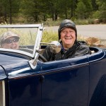 Happy older couple in car